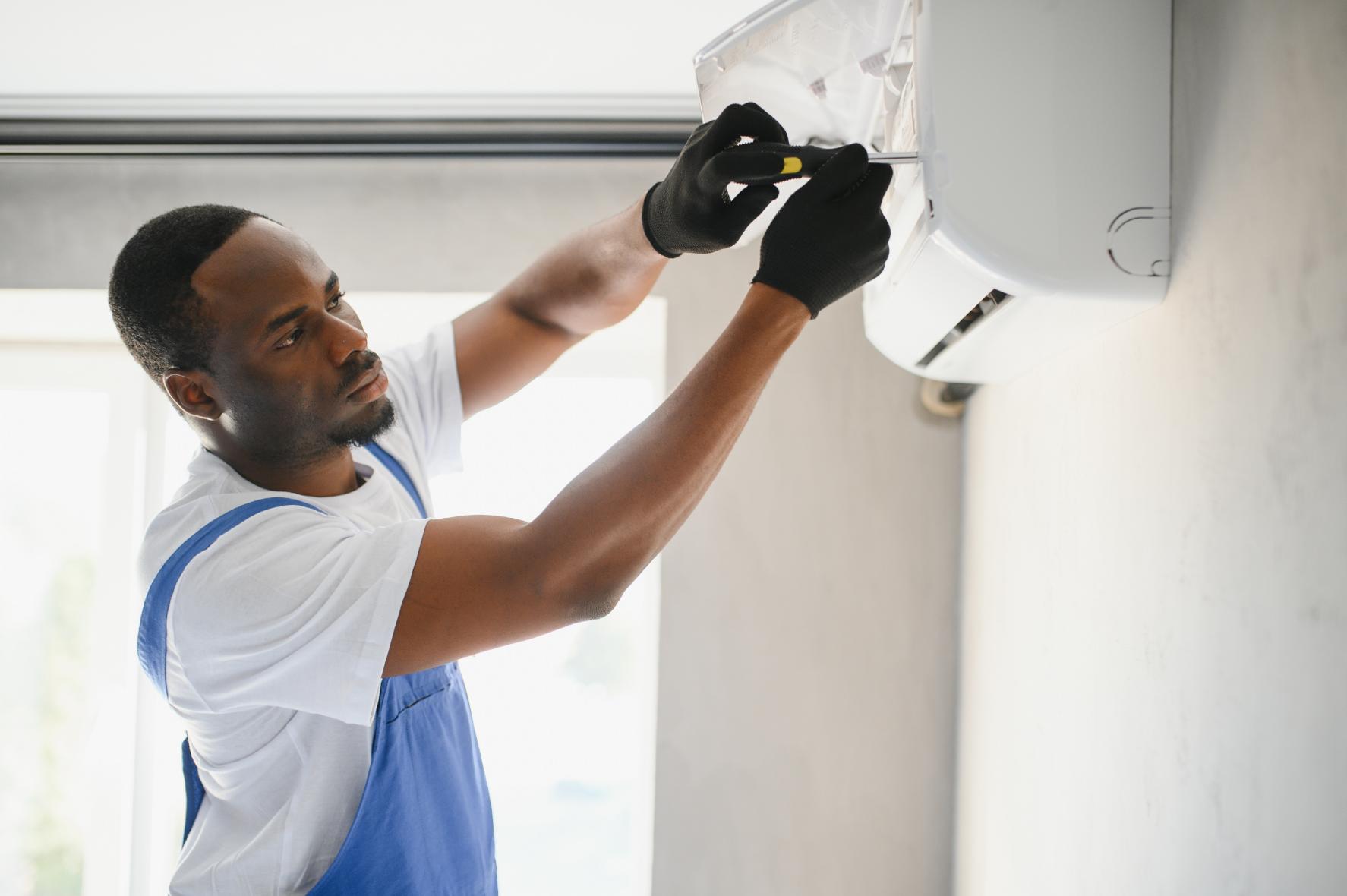 SummitAir technician installing indoor AC unit
